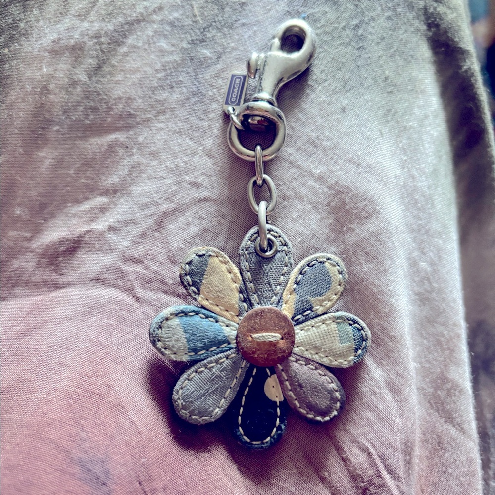 Coach keychain from the blue/purple patchwork purse. Super cute flower.